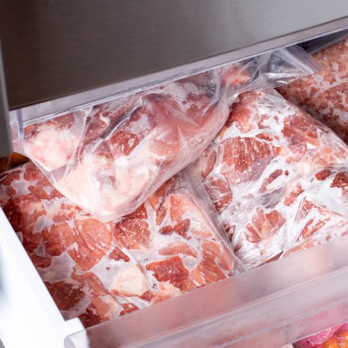 Frozen meat in a freezer draw